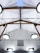 A modern ceiling design featuring wooden beams and multiple circular light fixtures. The ceiling has a high pitch with a skylight at the top center, and the beams form a triangular pattern. Several electrical wires and cables are arranged in a neat and organized manner.