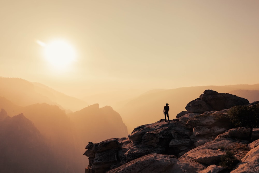 a person standing on top of a mountain