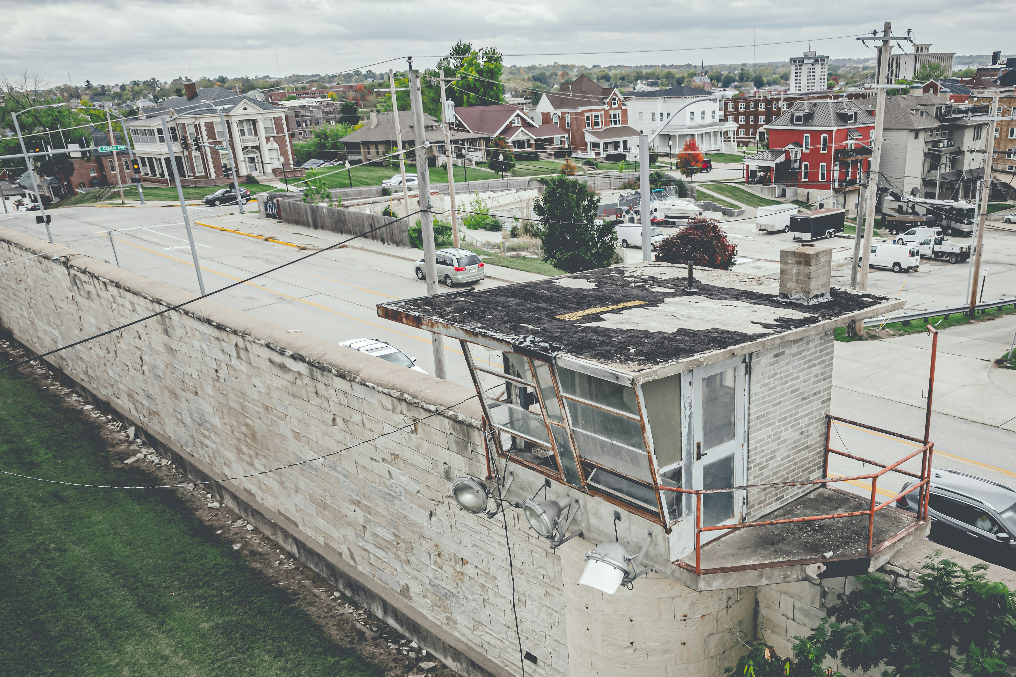 a view of a city from above of a bridge (Photo by Mike Gattorna on Unsplash)