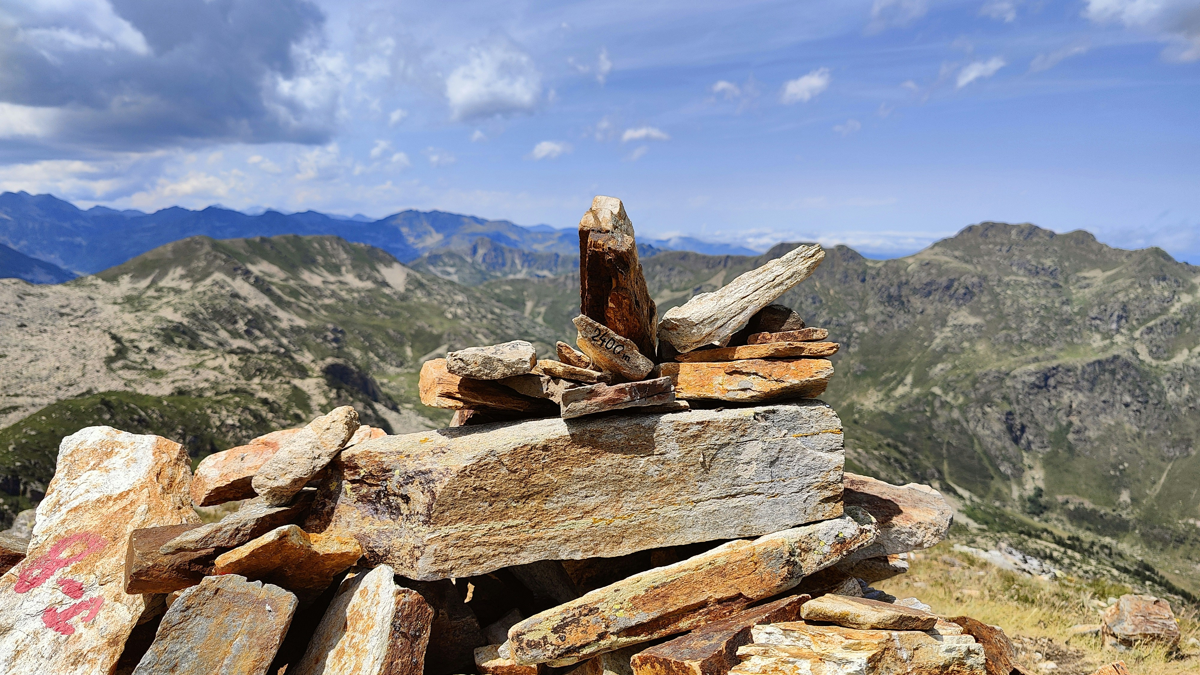 A pile of rocks sitting on top of a mountain photo – Free Pyrenees ...