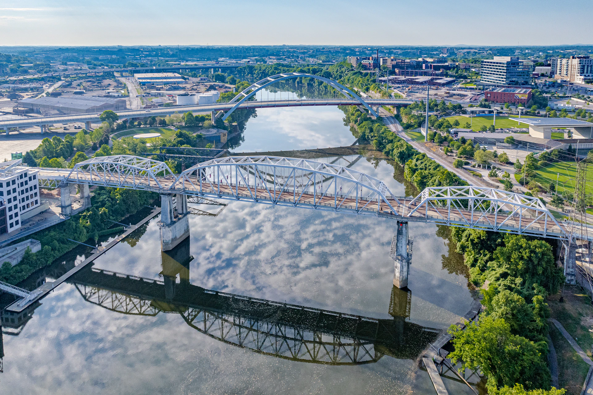 an aerial view of a bridge over a river