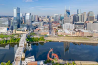 an aerial view of a city with a ferris wheel