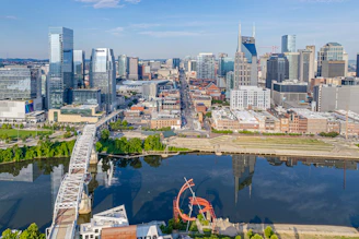 an aerial view of a city with a ferris wheel