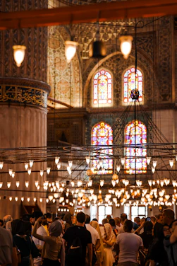 A warm gathering of diverse church members sharing fellowship in a bright, welcoming space.