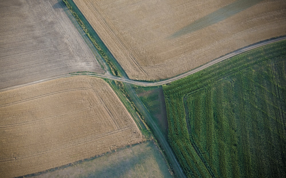 an aerial view of a road in a field