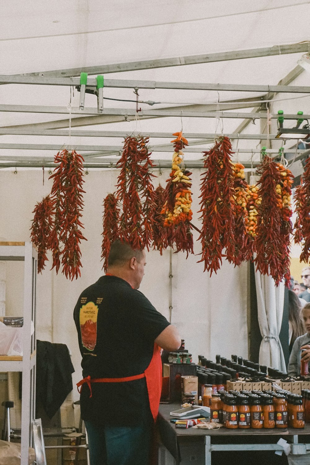 a man standing in front of a table filled with food