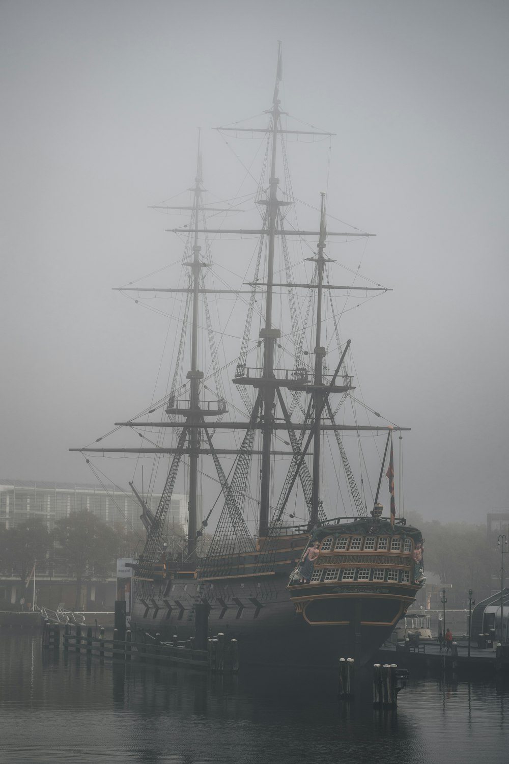 a large ship is docked in a harbor