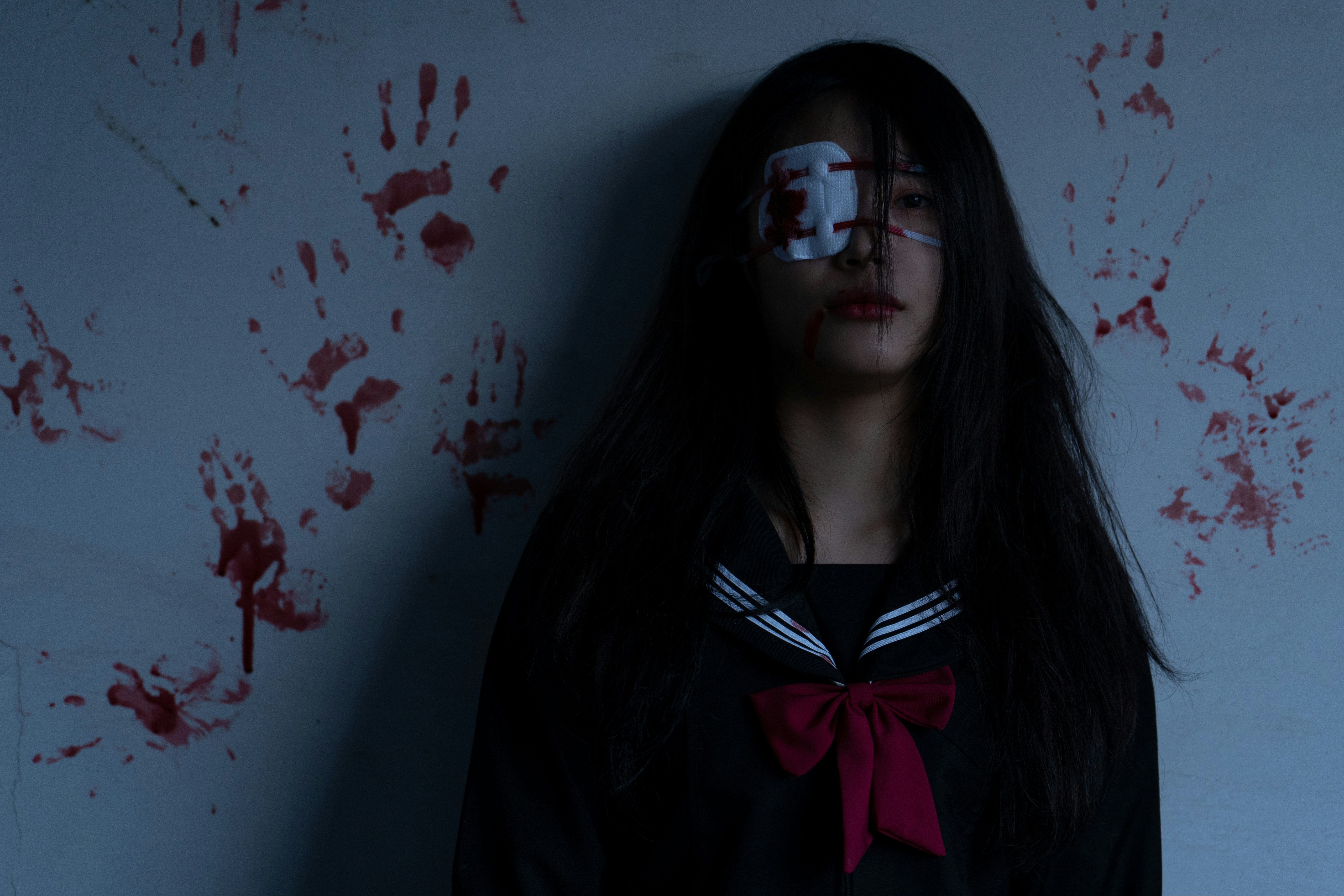 a woman with her face painted red and white