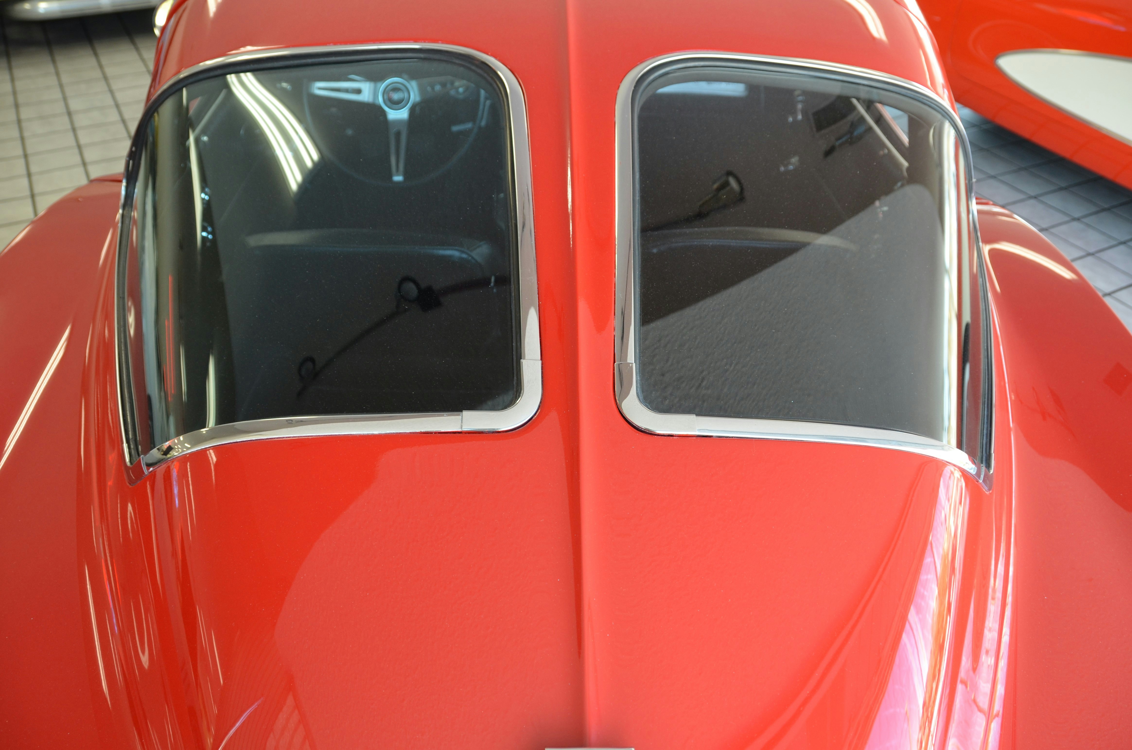 a close up of the front of a red car