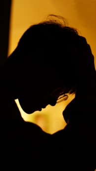 A warm, inviting illustration of a person gently confronting their inner voice, symbolizing the 'mowe' concept.