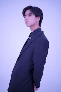 a man in a suit and tie posing for a picture