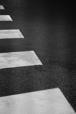 A classic black and white photo of the Beatles walking across Abbey Road.