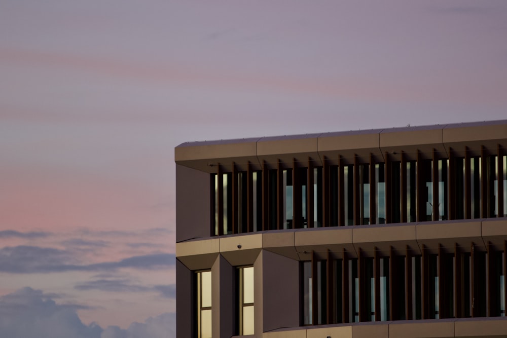 a tall building with a sky in the background