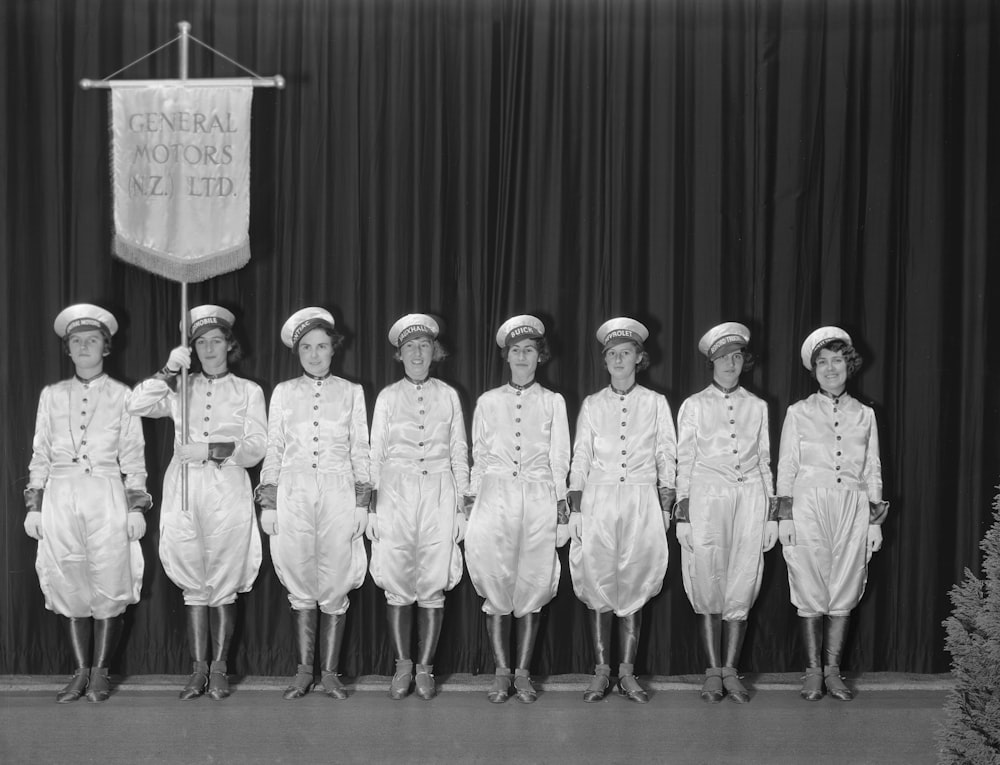 a group of women standing next to each other