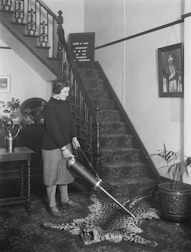 A powerful upright vacuum cleaner tackling carpet dirt with ease.