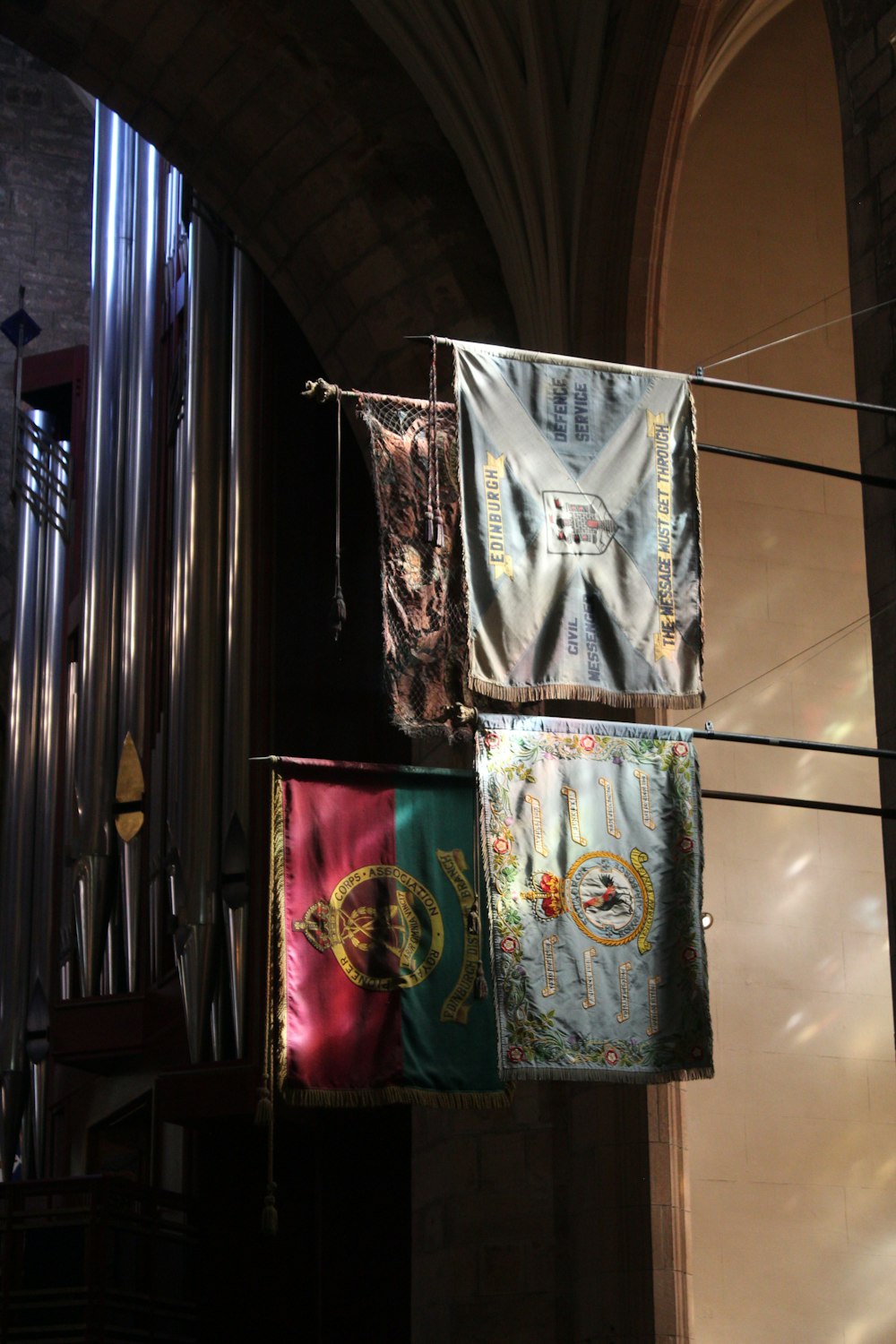 a group of banners hanging from a ceiling