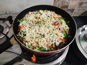A skillet sizzling with colorful one-pot meal ingredients