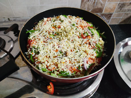 A vibrant skillet meal sizzling with fresh vegetables and herbs, capturing the essence of speedy, flavorful cooking.