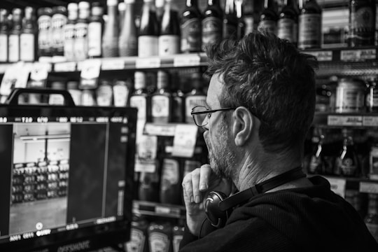 Consultant observing customer interactions in a busy retail store.
