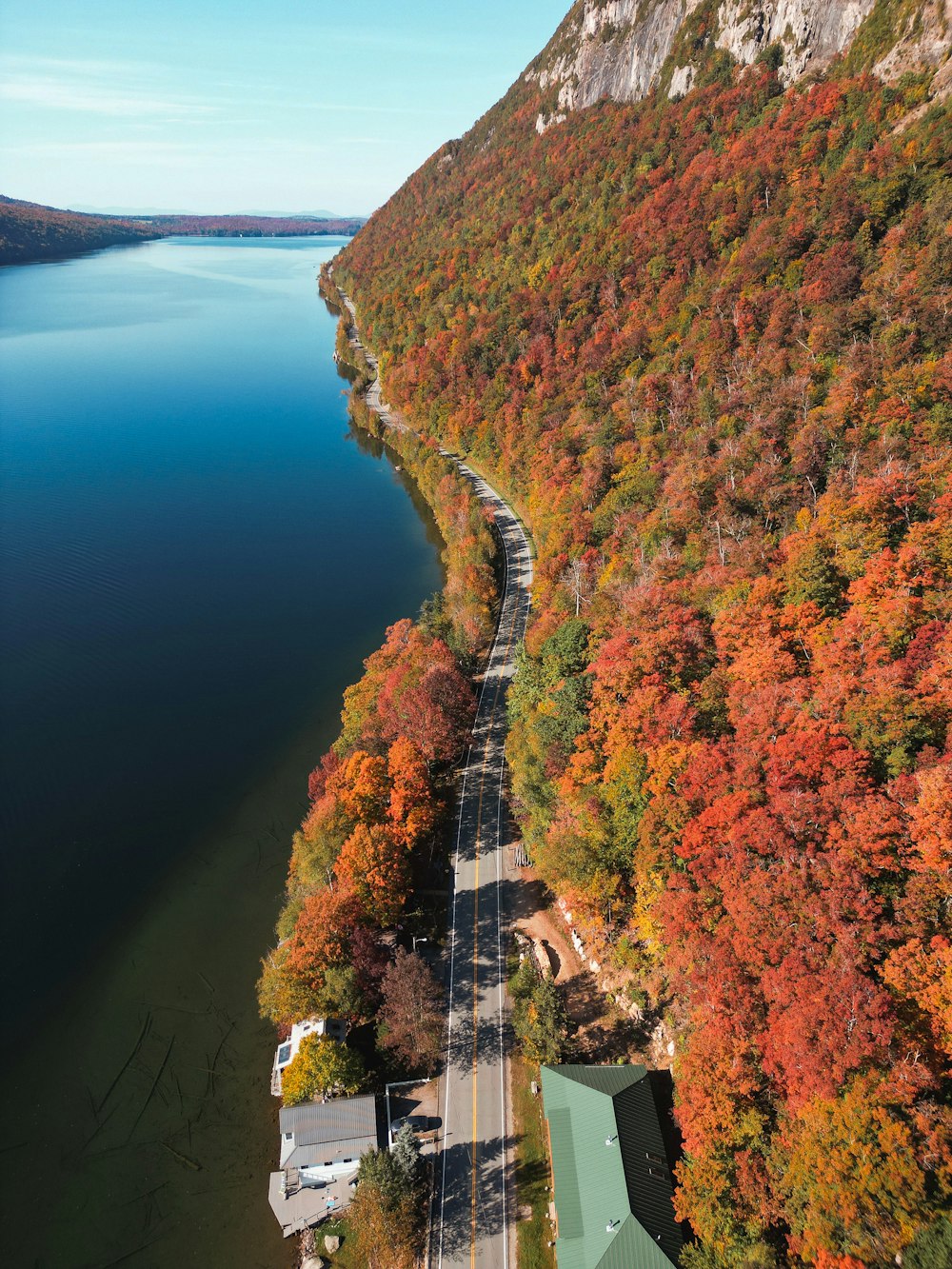 an aerial view of a lake surrounded by trees