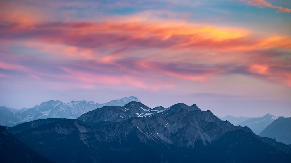 a view of a mountain range at sunset