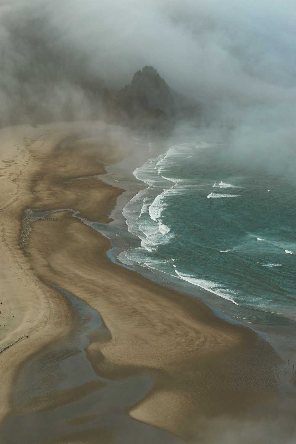 an aerial view of a beach and ocean