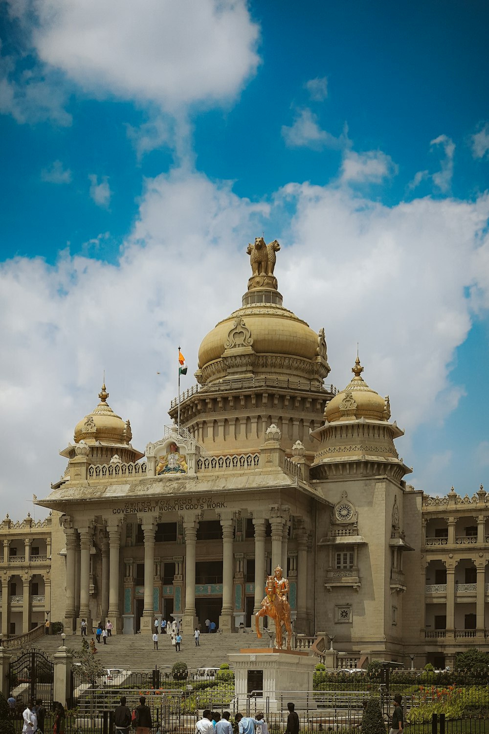 a large building with a statue in front of it