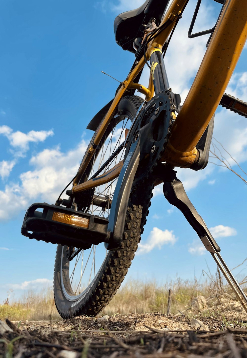 a bicycle is parked in the middle of a field