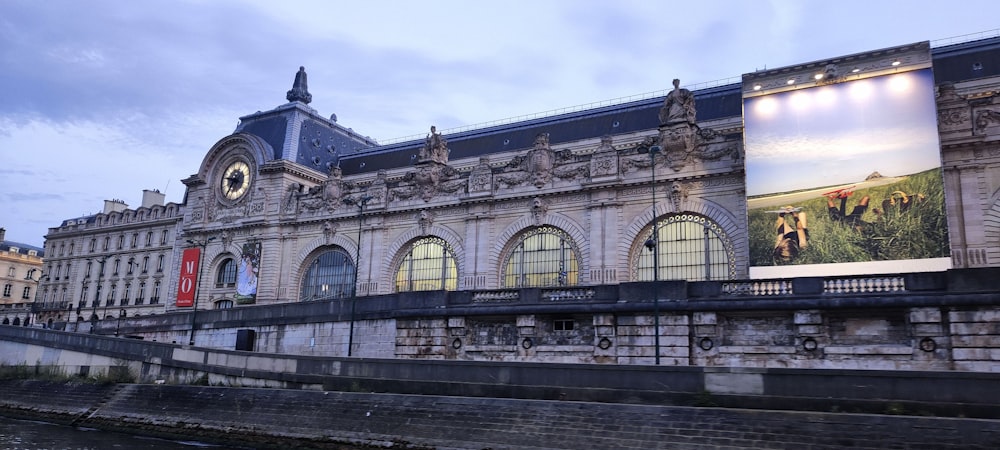 a large building with a clock on the side of it