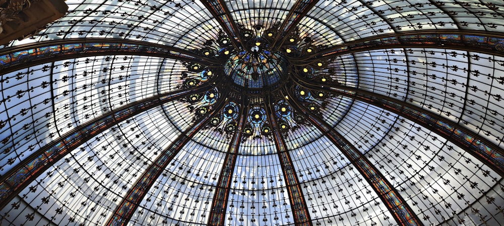 the ceiling of a building with many windows