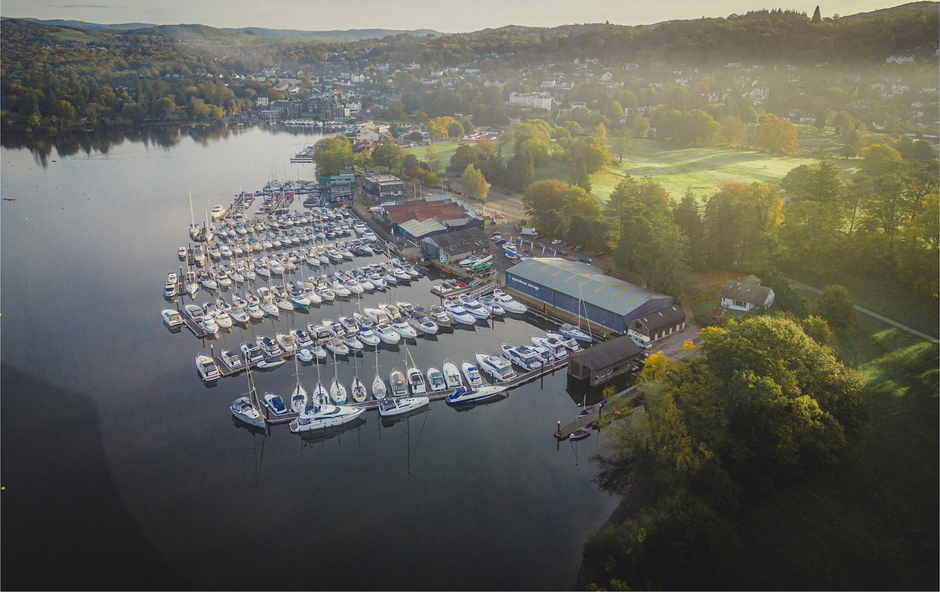 an aerial view of a marina with many boats