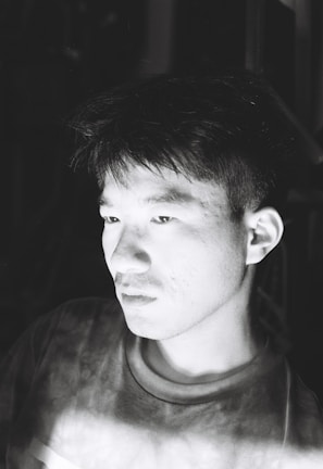 A candid portrait of a person immersed in thought.