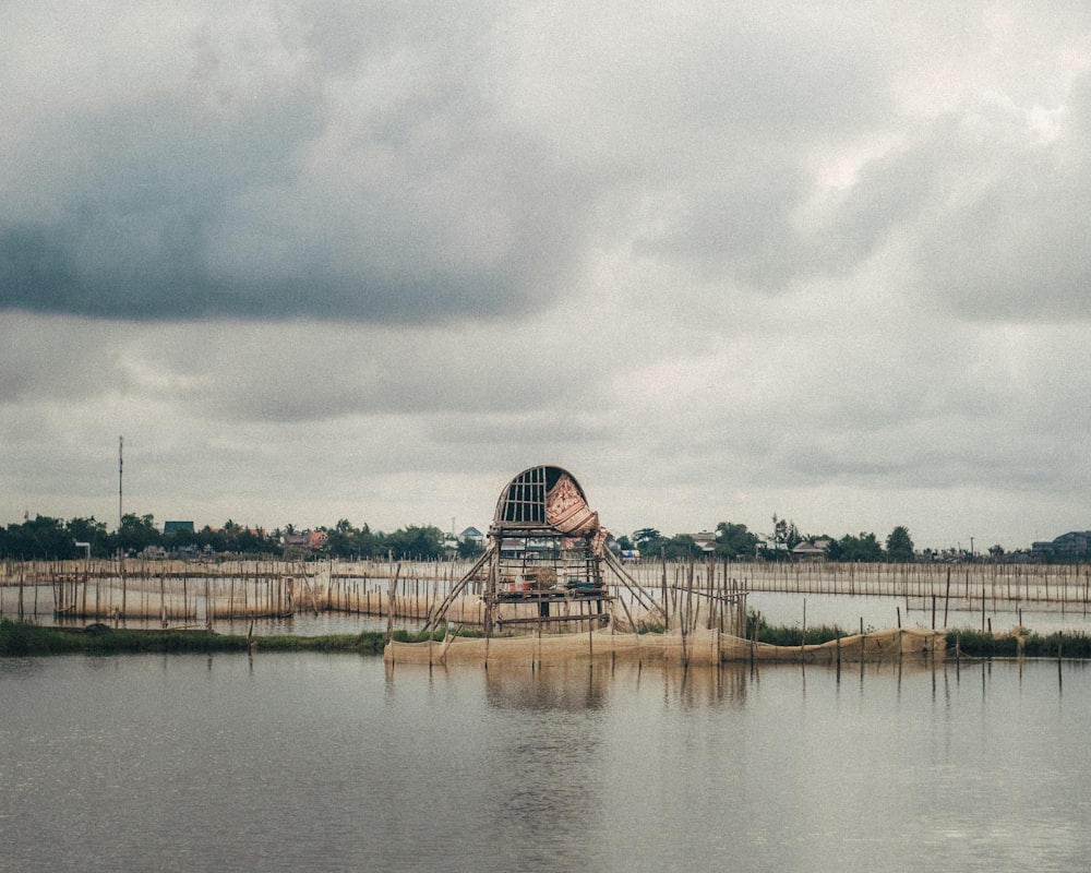 a large body of water sitting under a cloudy sky