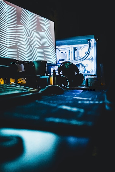 A sleek quantum computer setup glowing softly in a dimly lit lab, cables and hardware visible.