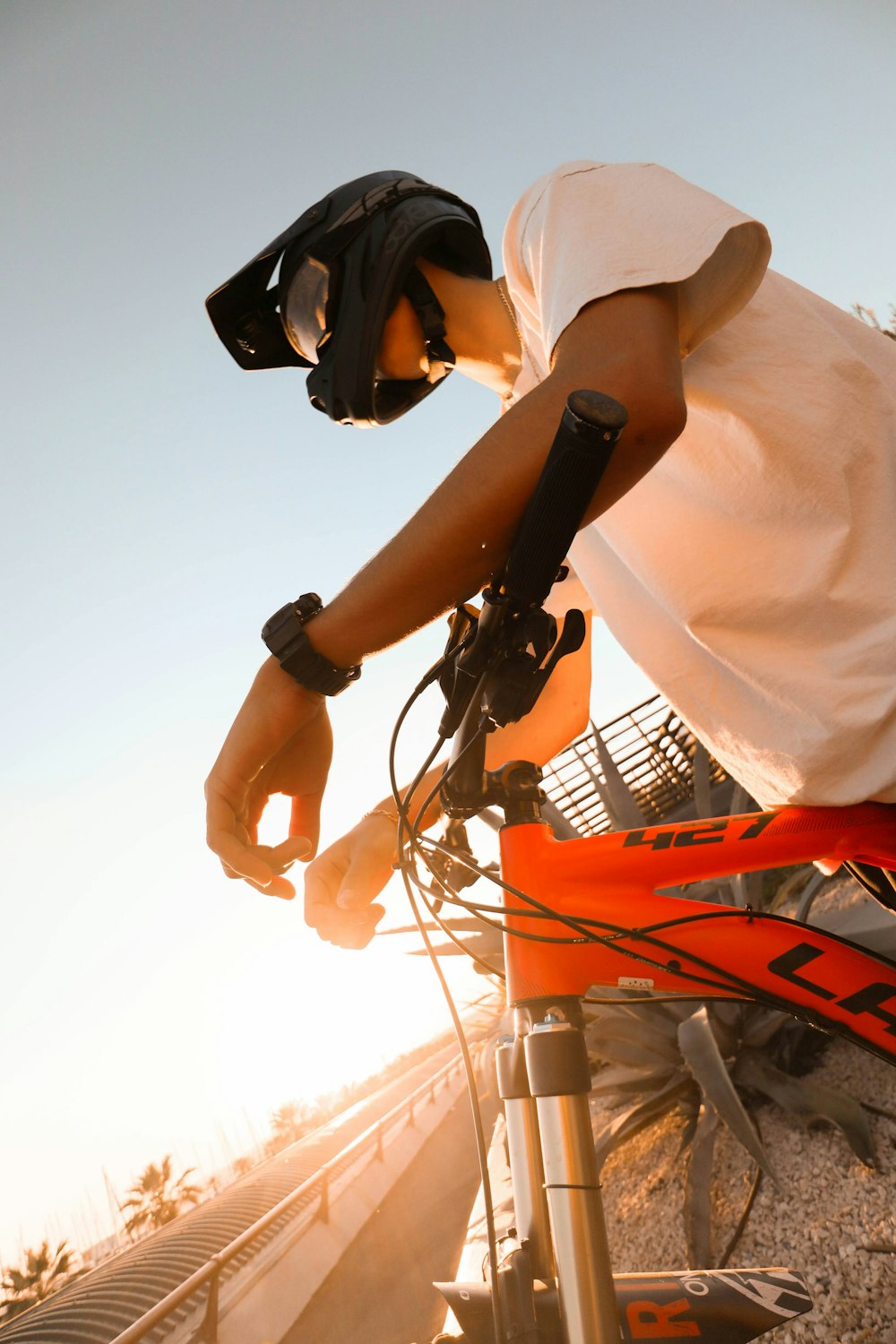 a man riding a bike down a street