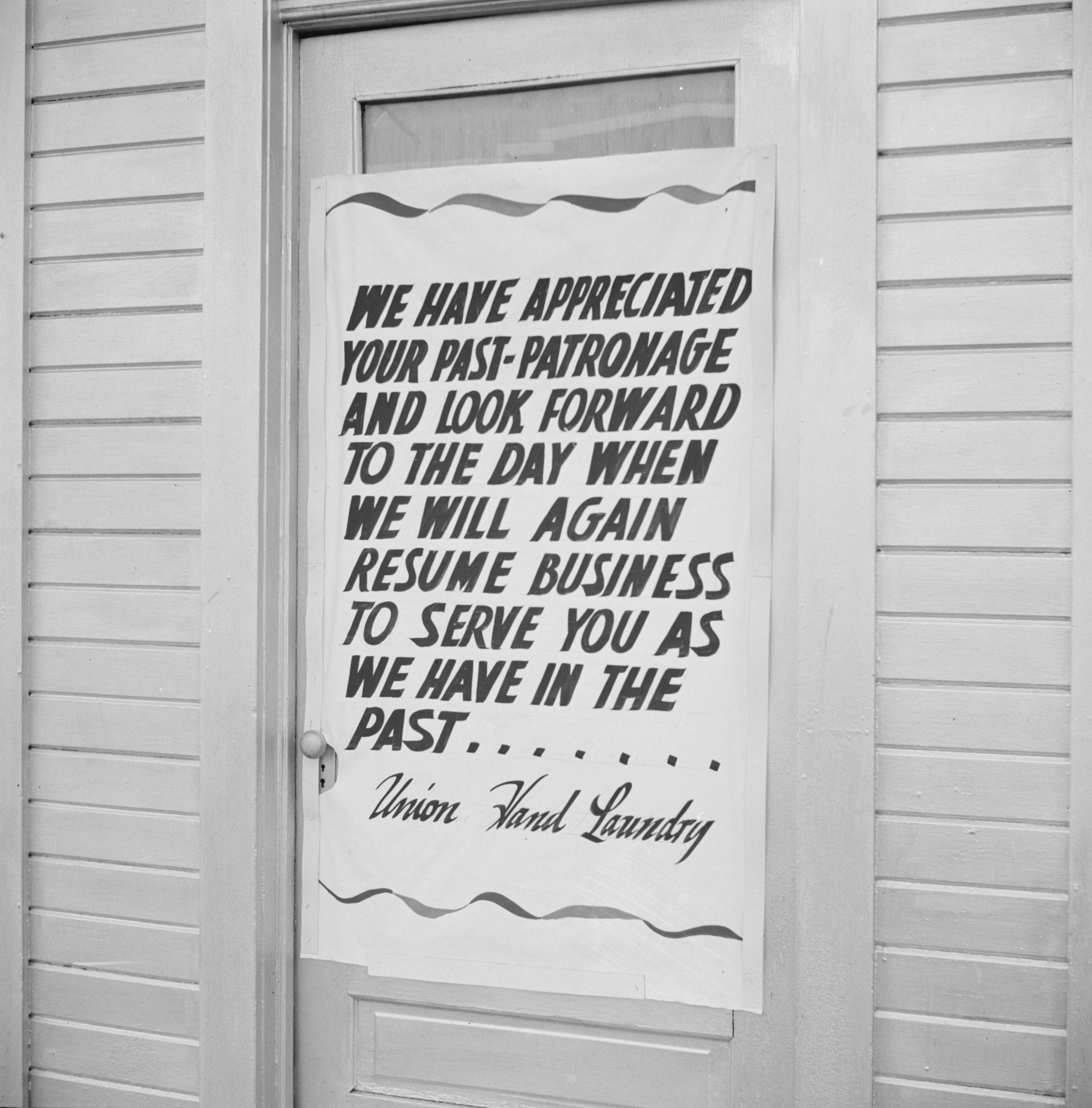 Los Angeles, California. Sign on a closed laundry.