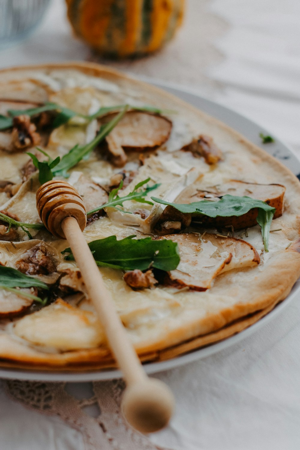 a pizza sitting on top of a white plate