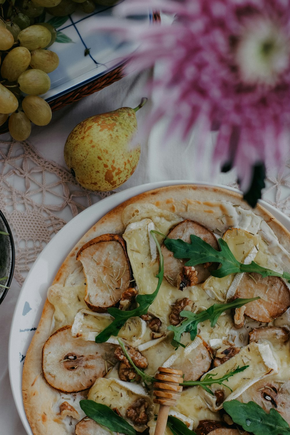 a pizza sitting on top of a white plate