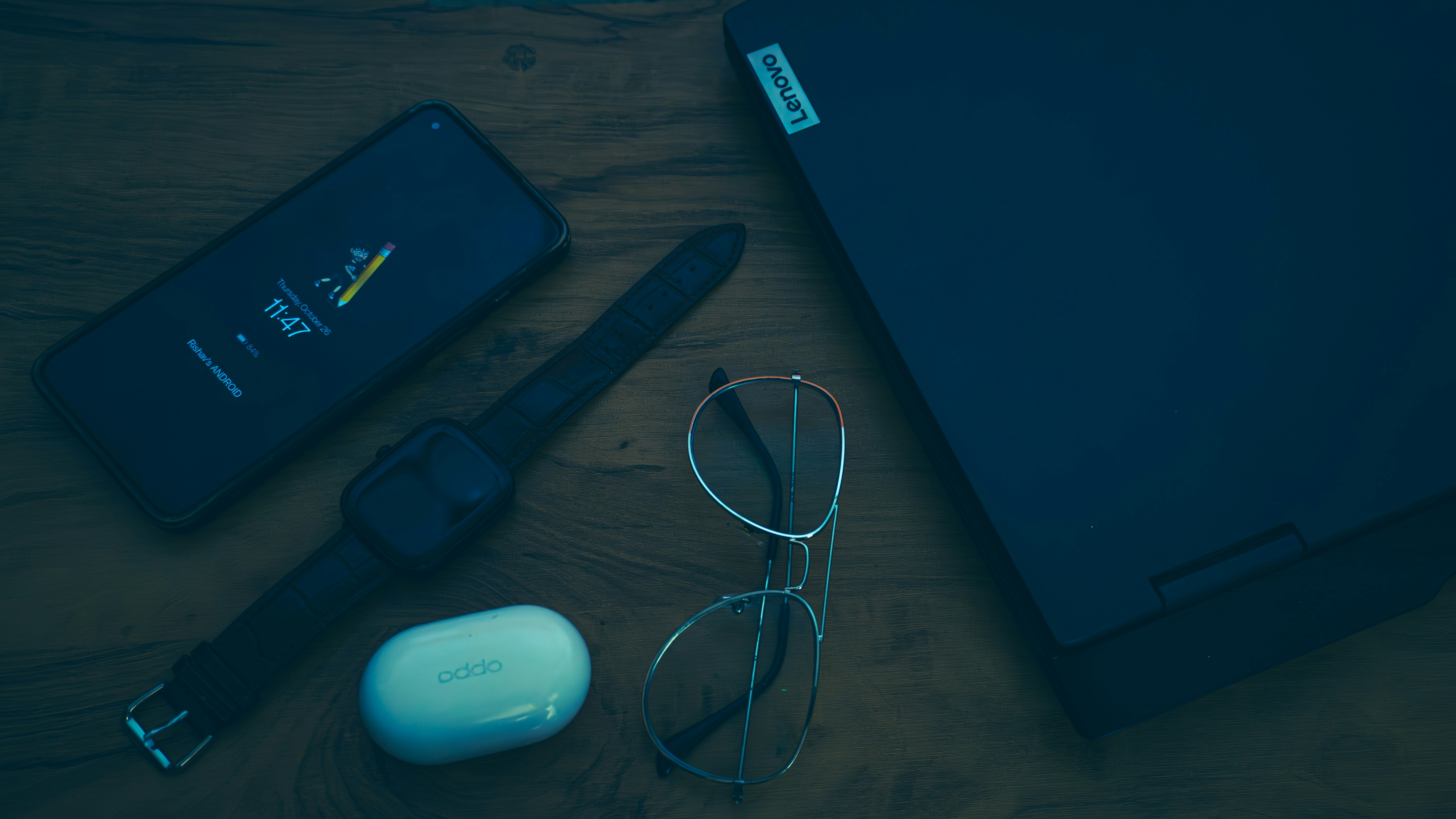 Laptop with sunglasses and phone