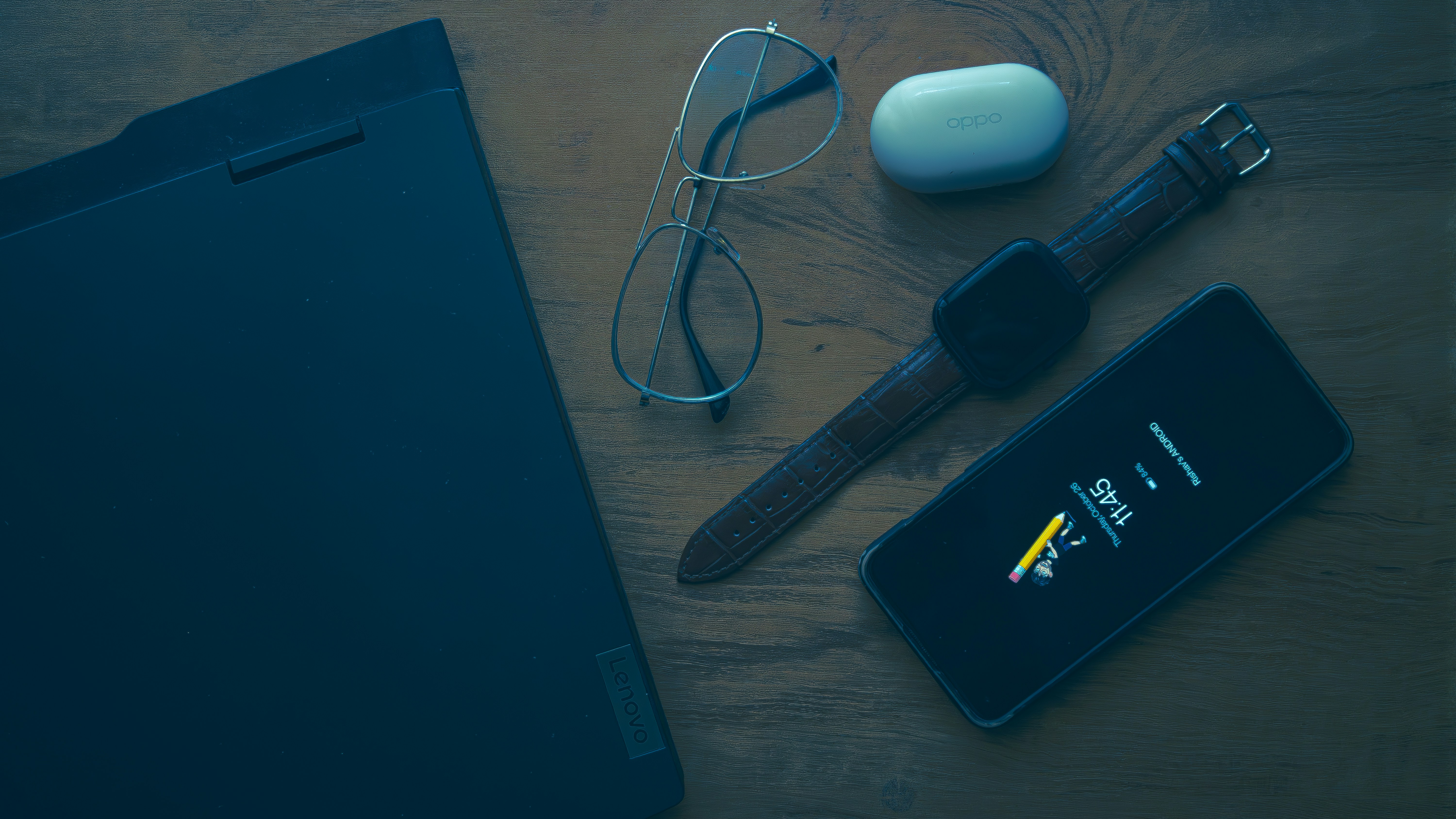 Laptop and mobile devices on table