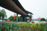 A panoramic view of a modern Chinese tech park bustling with activity.