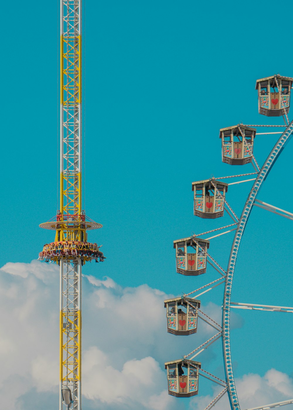 a ferris wheel sitting next to a ferris wheel