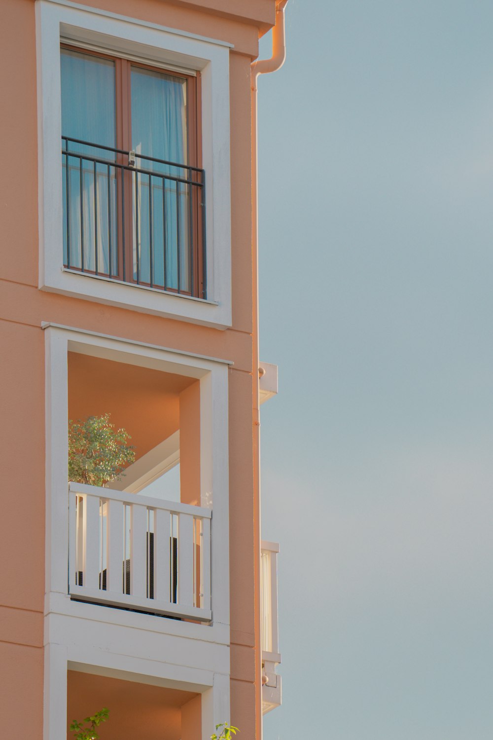 an apartment building with a balcony and balconies