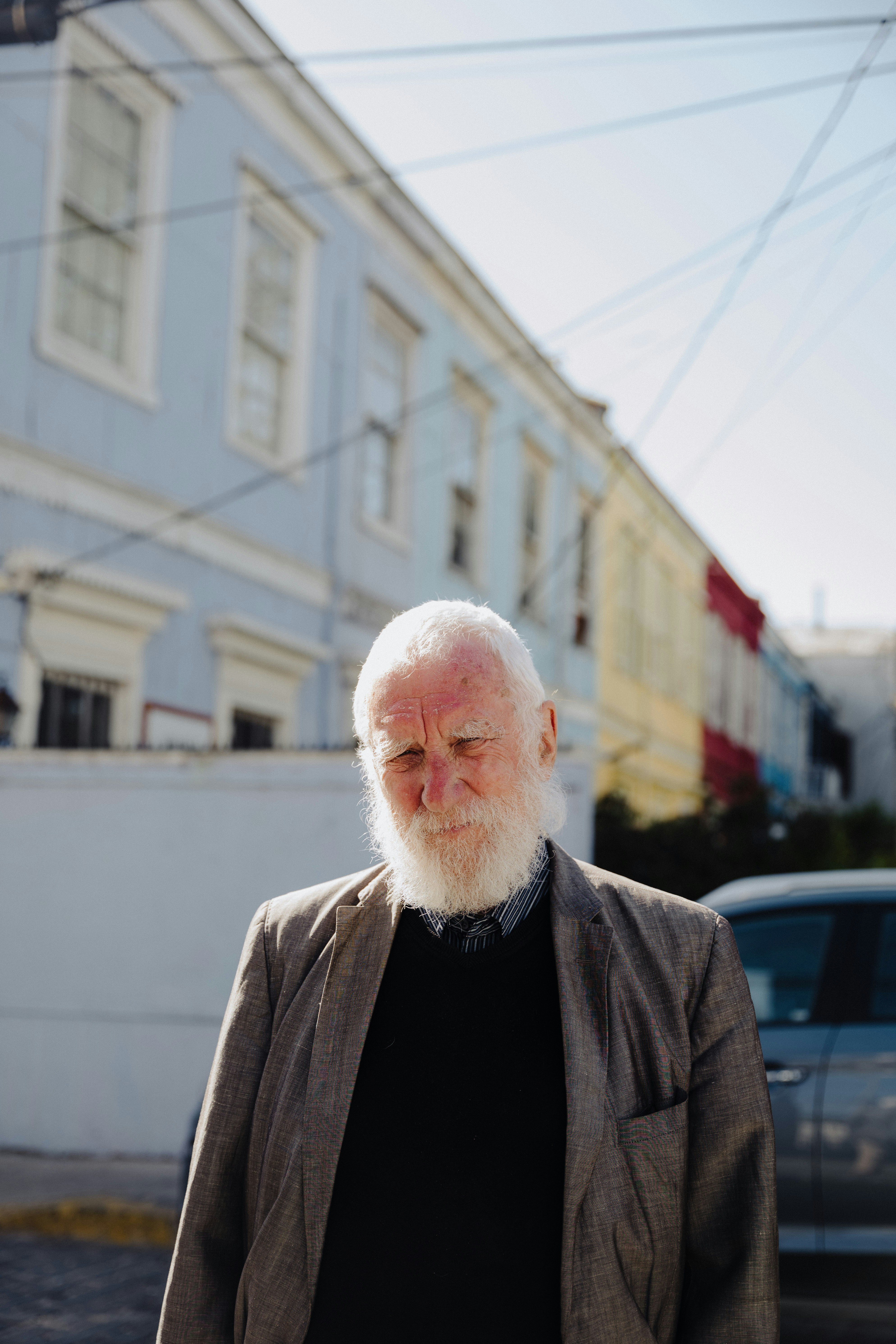 a man with a white beard and a black shirt