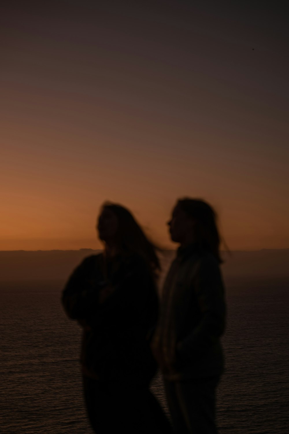 a couple of women standing next to each other