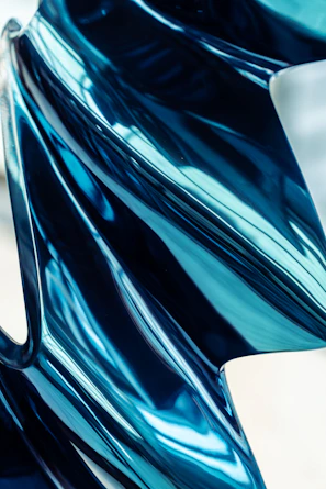 a close up view of a shiny blue object