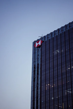 An elegant commercial building illuminated at dusk, symbolizing reliability.