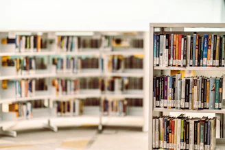 Volunteers sorting donated books in a bright community center.