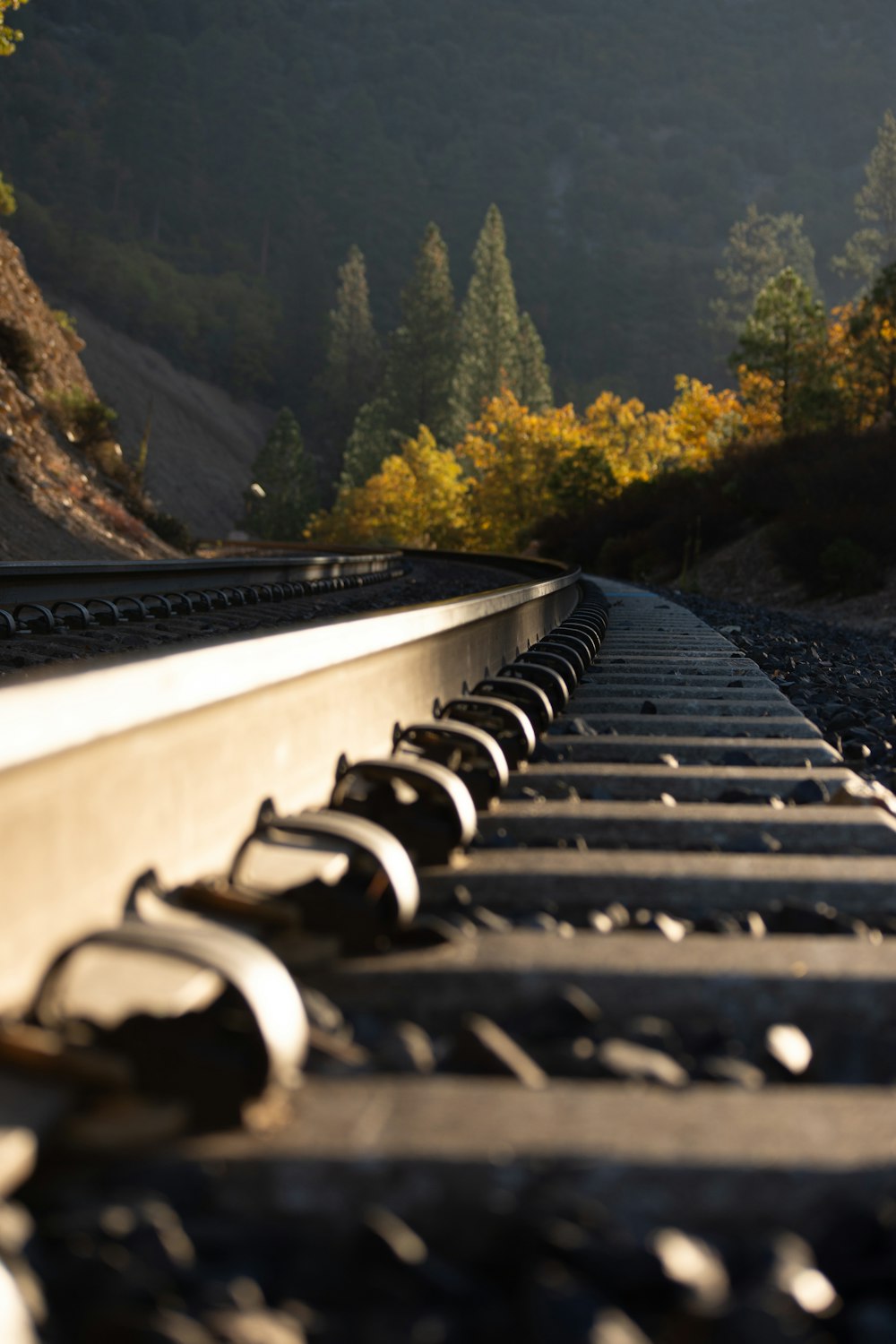 a long train track with a mountain in the background