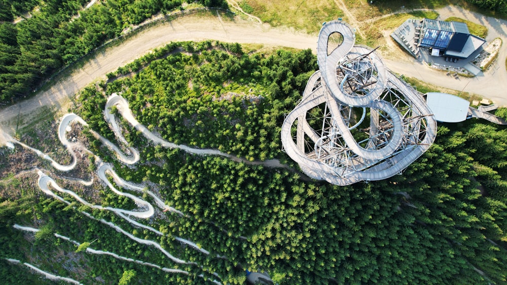 an aerial view of a building in the middle of a forest